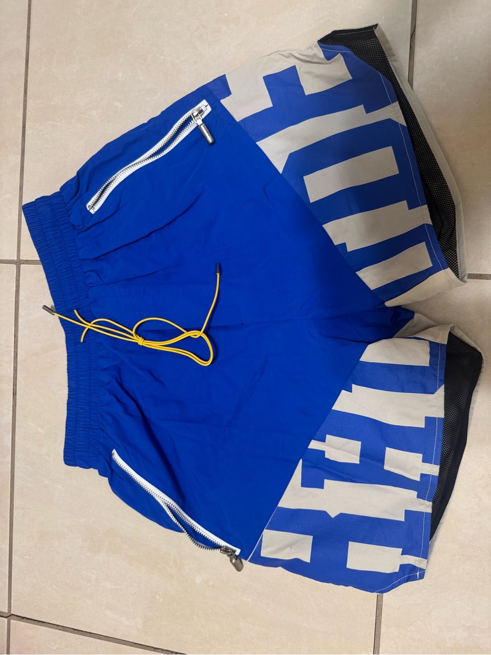 Rhude Blue Athletic Shorts with White Panels and Yellow Drawcord